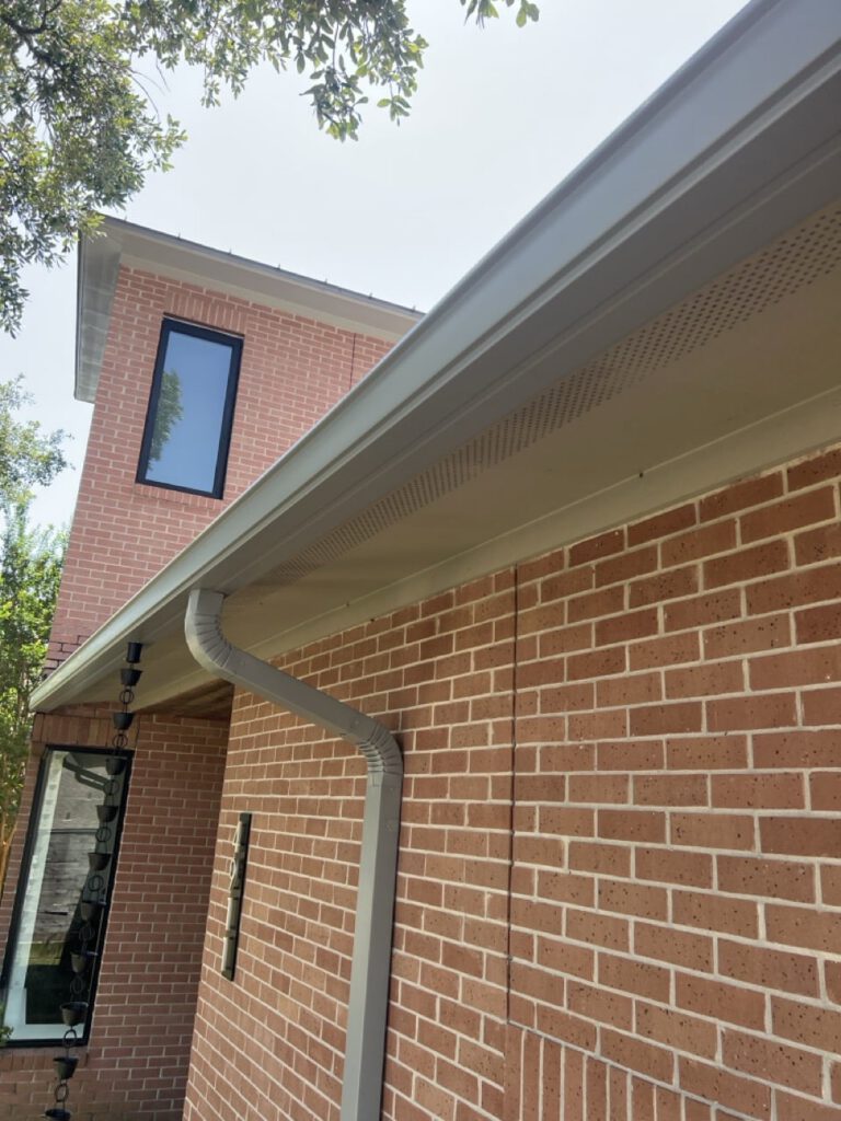Seamless gutter and downspout on new brick home, Northwest Houston